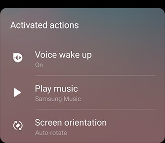 Photo simulée de l’interface Bixby Routines pour la tâche Conduire. Elle détaille les actions activées, à savoir la fonctionnalité Voice wake-up, le lecteur Play Samsung Music et la rotation automatique de l’écran.