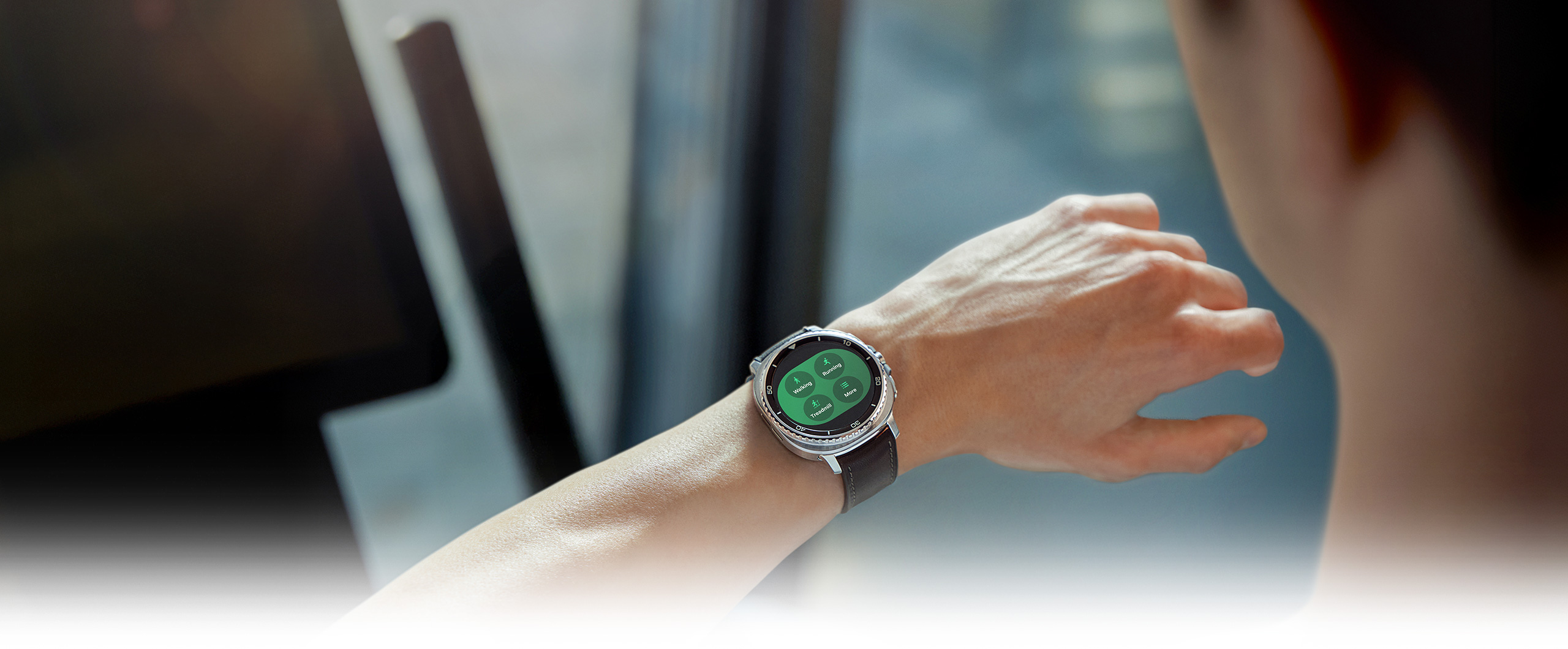 Person wearing Galaxy Watch8 Classic. Exercise tracking feature is onscreen, displaying Walking, Running, Bike and More.