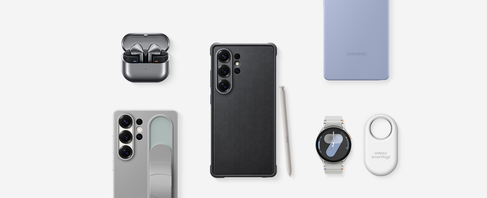 Vista superior de los accesorios Samsung para el Galaxy S25 Ultra: Primero, los Galaxy Buds3 Pro en Silver con los auriculares, el Galaxy S25 Ultra con el Rugged Case instalado y el S Pen en Gris claro, el Galaxy S25 Ultra con el Silicone Case en Azul claro instalado, el Galaxy Watch Ultra en Titanium Silver, el Galaxy S25 Ultra con Standing Grip Case en Gris instalado.