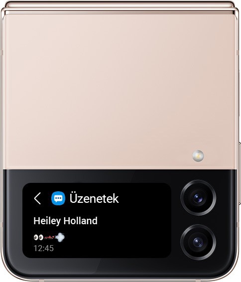 Egy összehajtott Rózsaarany Galaxy Z Flip4, fedőképernyőjén egy szöveges üzenettel kapcsolatos figyelmeztetés. Egy sor emoji szimbólumot látunk: szemek, versenyautó és szél.