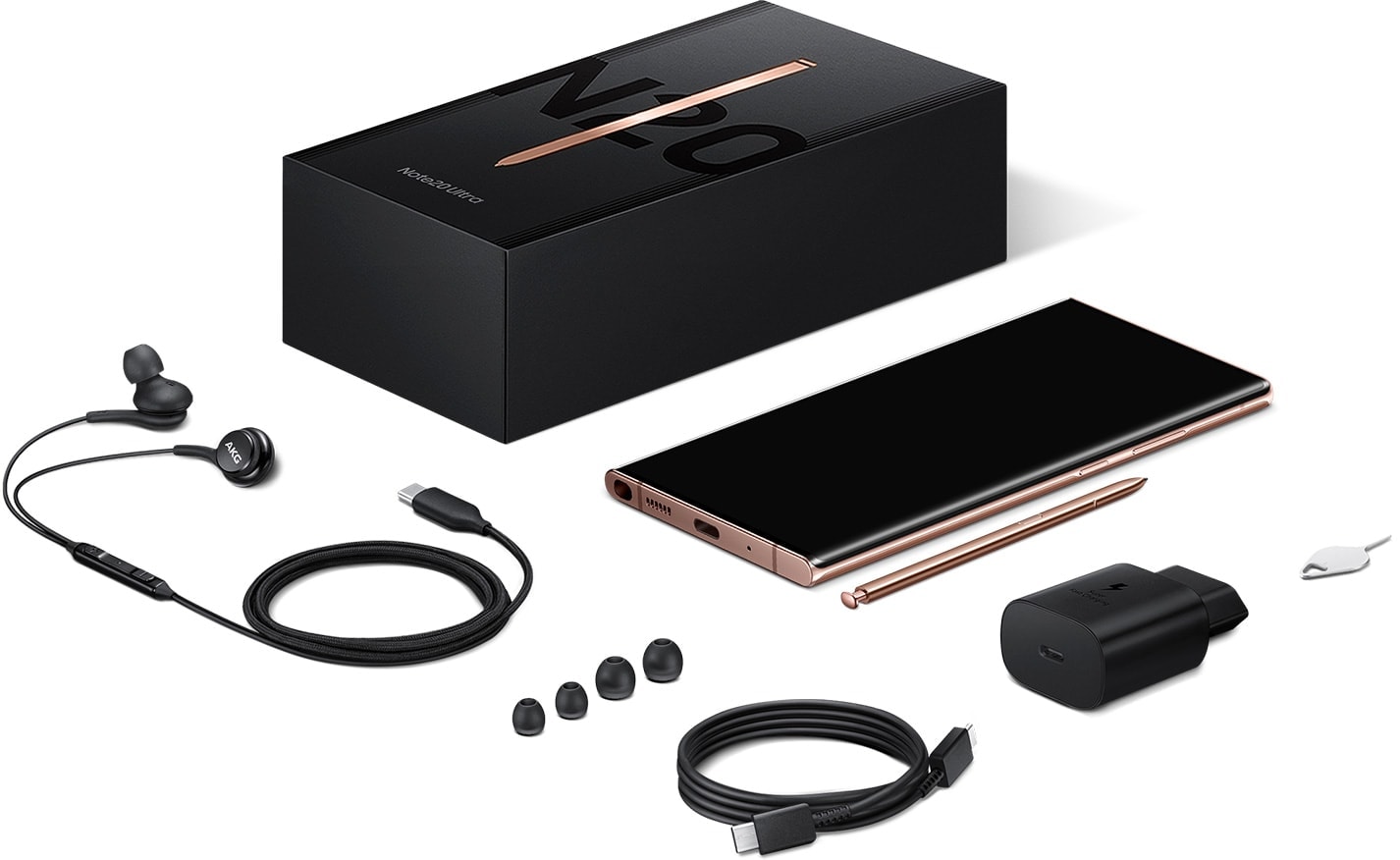 Flatlay of the items included in box with Galaxy Note20 and Note20 Ultra. Shown is the package, the phone, the S Pen, AKG earphones, eartips, USB Type-C cable, wall adapter, and SIM card ejector.