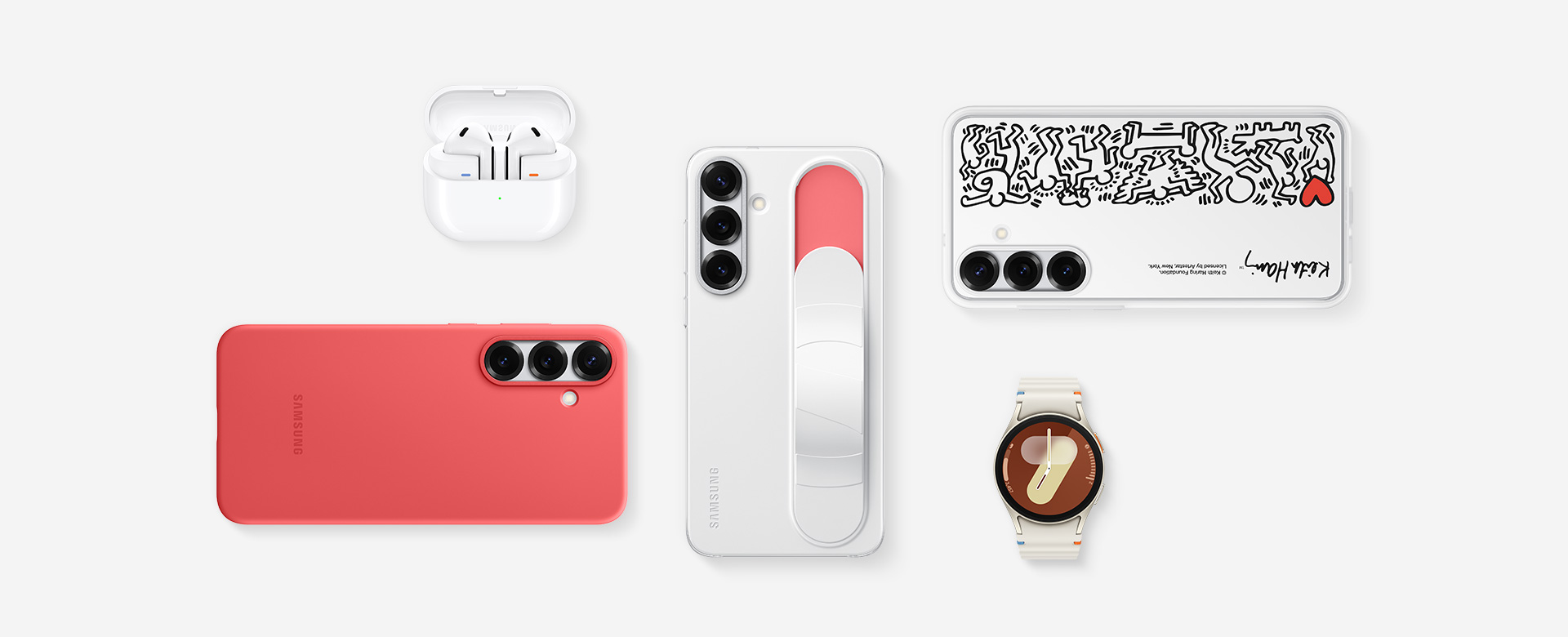 A flat lay of Samsung accessories for Galaxy S25 plus: Galaxy Buds3 in White with the ear buds, Galaxy S25 plus with Standing Grip Case in White installed, Galaxy S25 plus with Flipsuit Case in White installed, Galaxy Watch7 in Cream, Galaxy S25 plus with Silicone Case in Red installed.