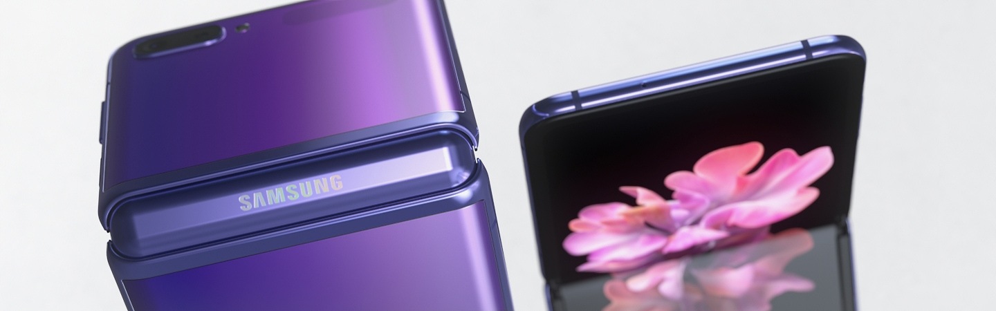Two purple Samsung Galaxy Z Flip mobiles are folded 90 degrees, one is showing its thin glass screen and the other is showing its back.