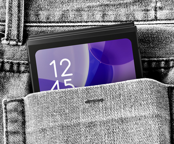 Galaxy Z Flip7 FE is seen in Black. It is folded and comfortably fits in a pocket.