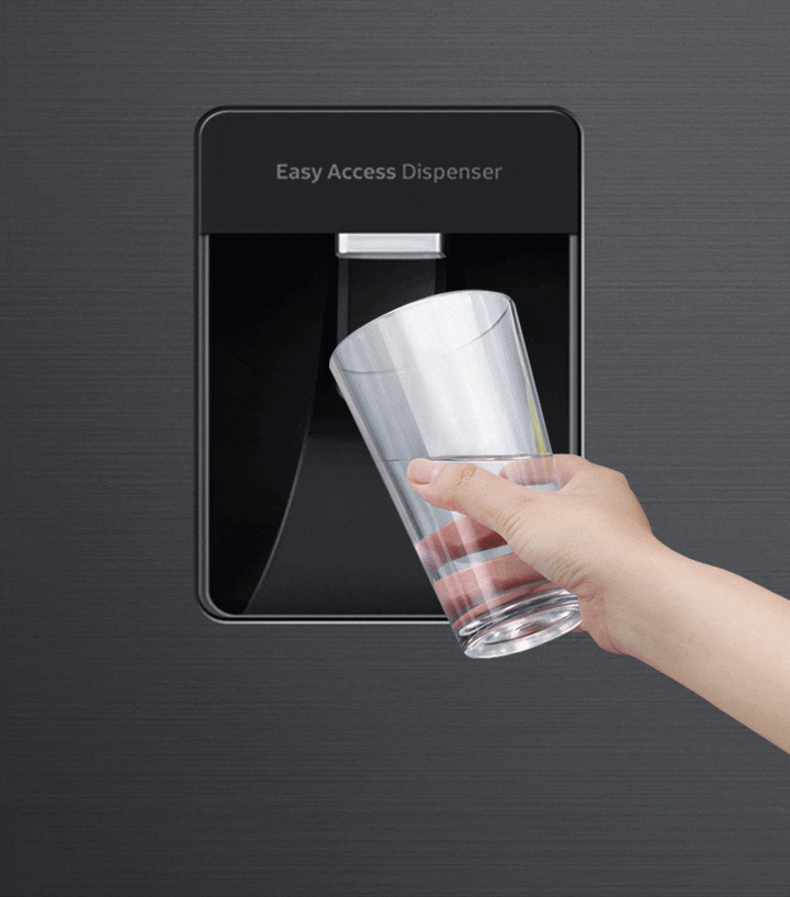 A user fills a cup with water from a easy access dispenser, with logo that reads BPA Free in the bottom left corner.