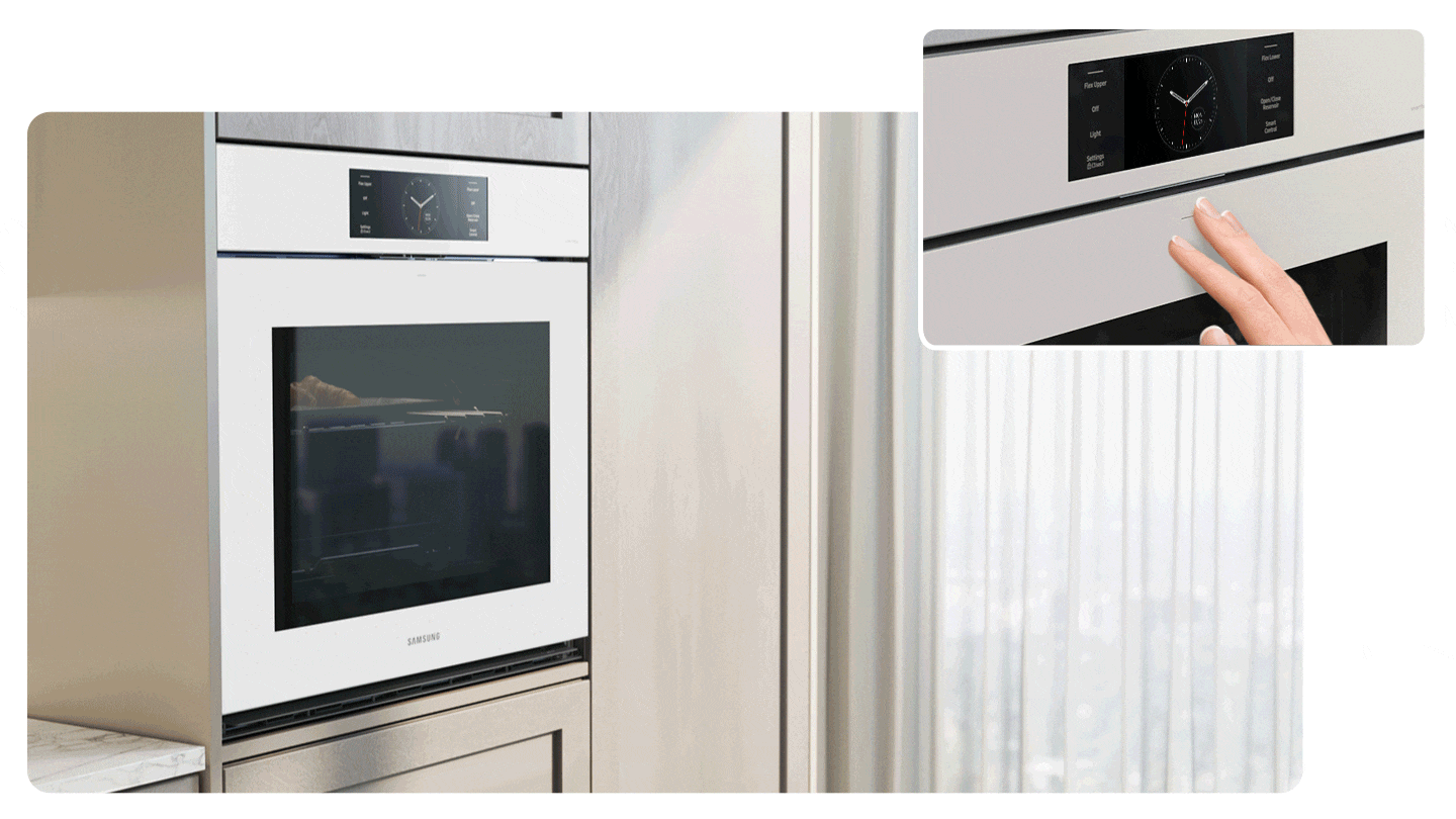 A hand presses the built-in oven, and the door smoothly opens.