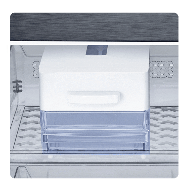 Twist Ice Maker is on a shelf in the freezer. With a twist, lots of ice falls into the removable storage bin below.