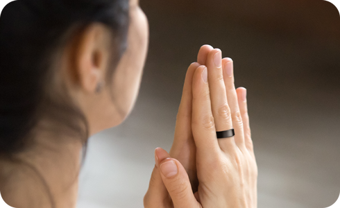 A person wearing the Galaxy Ring while doing Yoga.