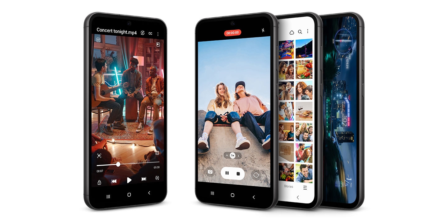 Four Galaxy S23 FE devices standing upright showing their front. All of them have their screens on displaying either a video or picture being taken, a photo gallery or a video game being played.