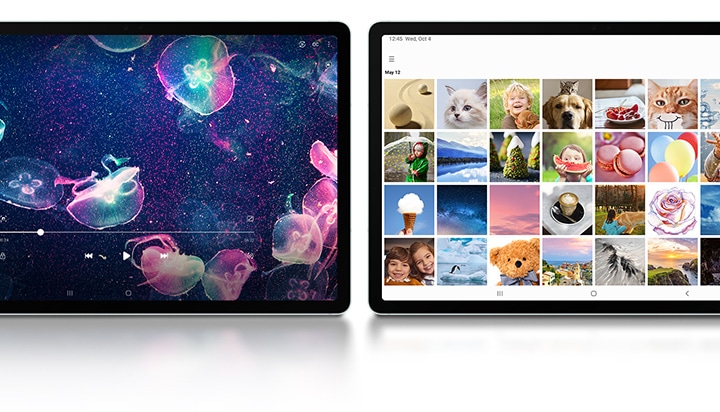 Two Galaxy Tab S9 FE+ devices in Mint placed next to each other in Landscape mode, facing forward. On the left one, a video of colorful jellyfish is playing fullscreen. On the right one, the Samsung Gallery app is open fullscreen.