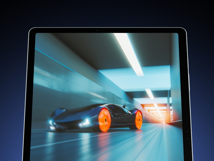 Galaxy Tab S9 FE+ in Portrait mode, facing forward with a fast-moving car driving through a tunnel shown oscreen, highlighting the smooth screen motion.