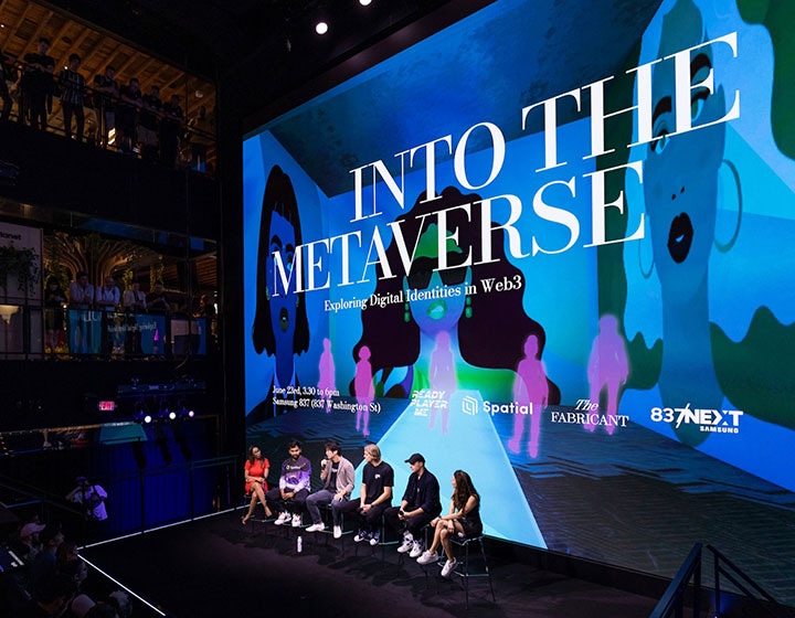 A group of NFT art and metaverse creators speaking on stage 