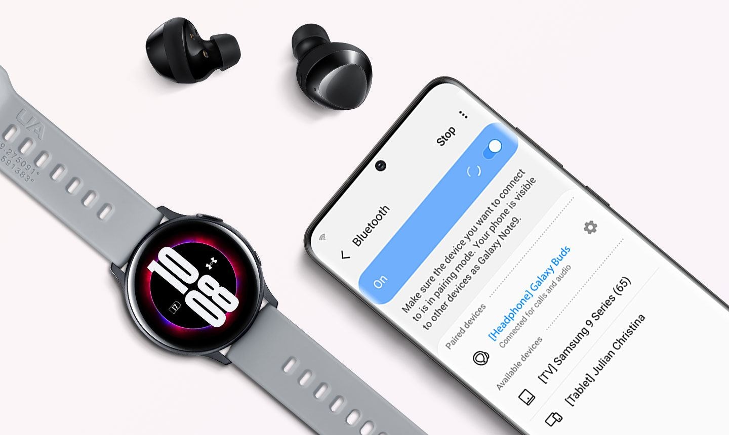 Black Galaxy Buds plus next to compatible Galaxy devices, with a phone displaying the Bluetooth pairing screen and a watch showing the time.