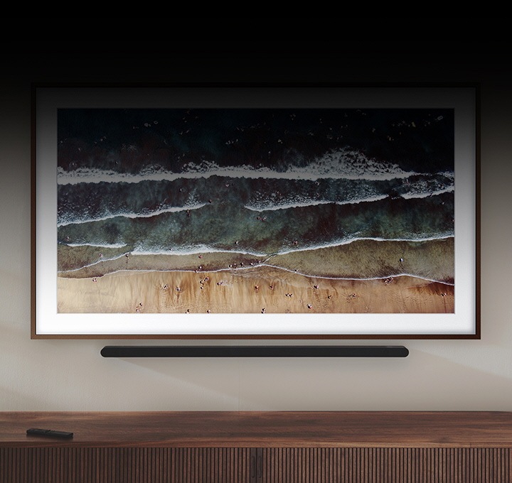 Ultra Slim Soundbar mounted beautifully on a living room wall below a Samsung TV.