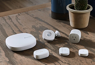 SmartThings hubs on a wooden table