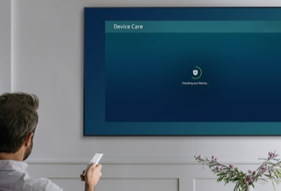 Person looking at Device Care on a Samsung TV