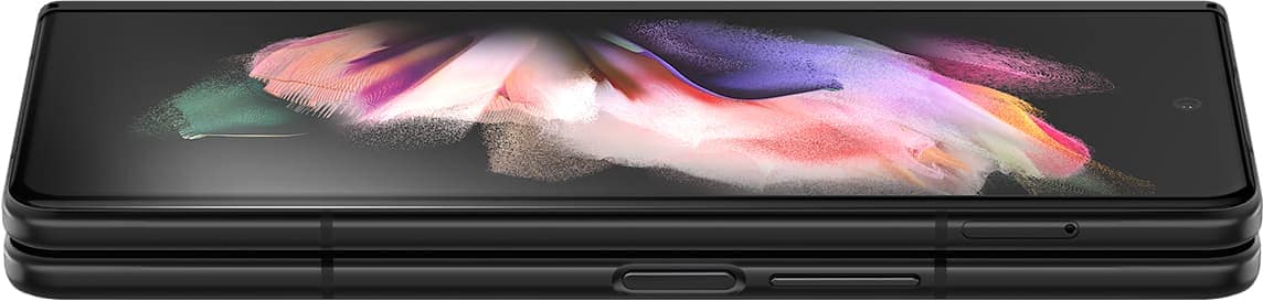 Folded Galaxy Z Fold3 5G seen from the open side. A colourful wallpaper is seen on the Cover Screen, and it turns slightly until only the edges show, to demonstrate how thin Corning® Gorilla® Glass Victus™ is.