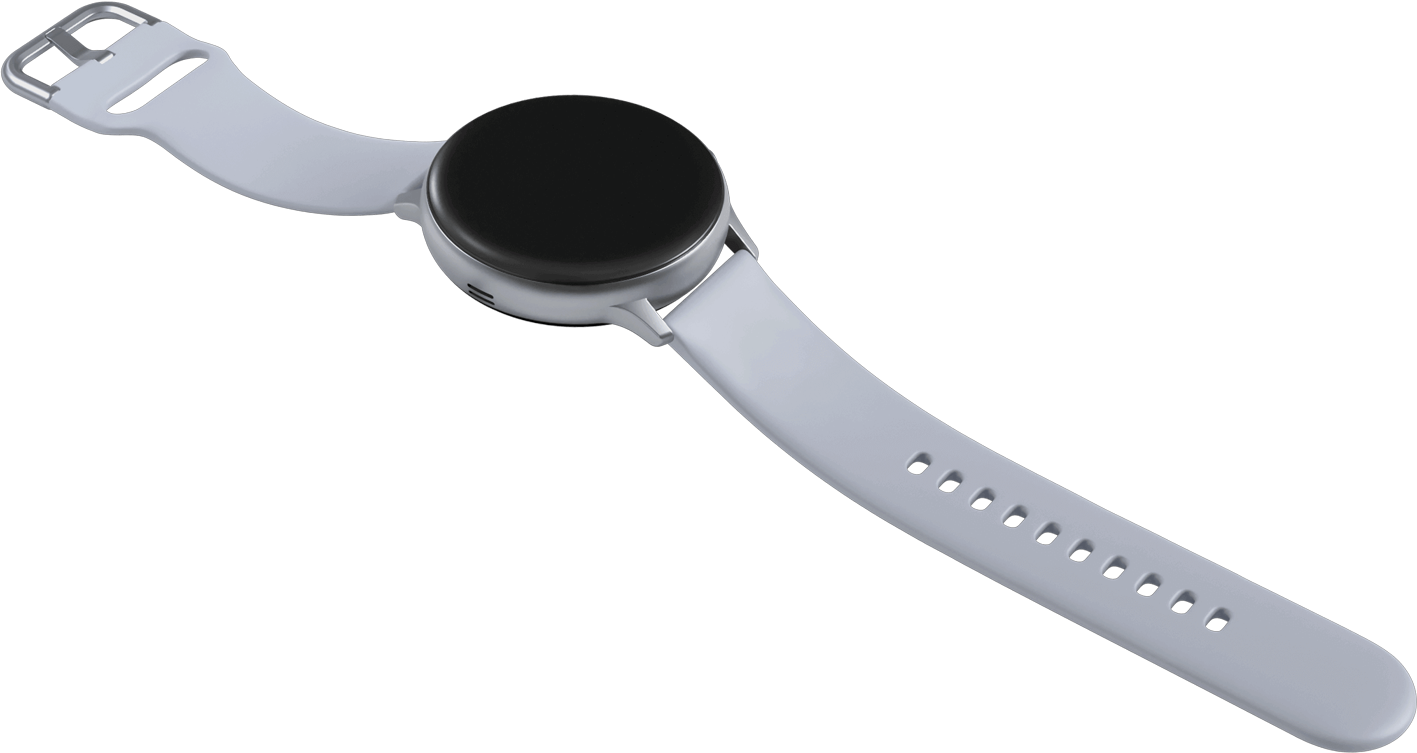 A Galaxy Watch active2 watch in cloud silver charging on a coin-shaped wireless charger directly below it that has the same circumference as the watch face.