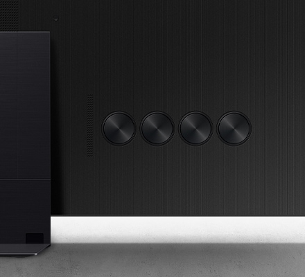 A close-up of the back of the 2024 Neo QLED TV showing 4 round speakers.