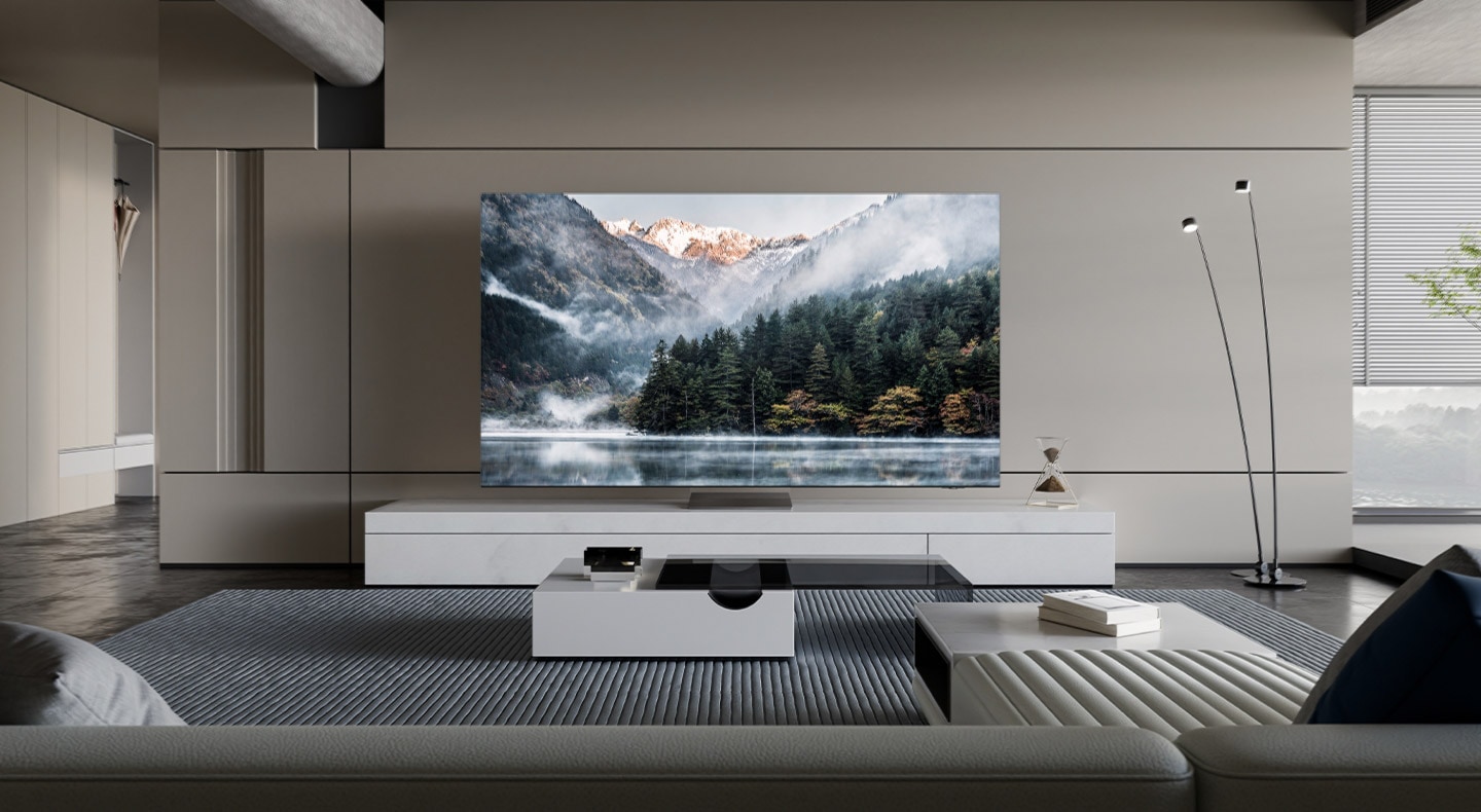 The latest Samsung Neo QLED TV with its Infinity Air Design and attachable One Connect box harmonizes with the surrounding furniture in a modern living room.