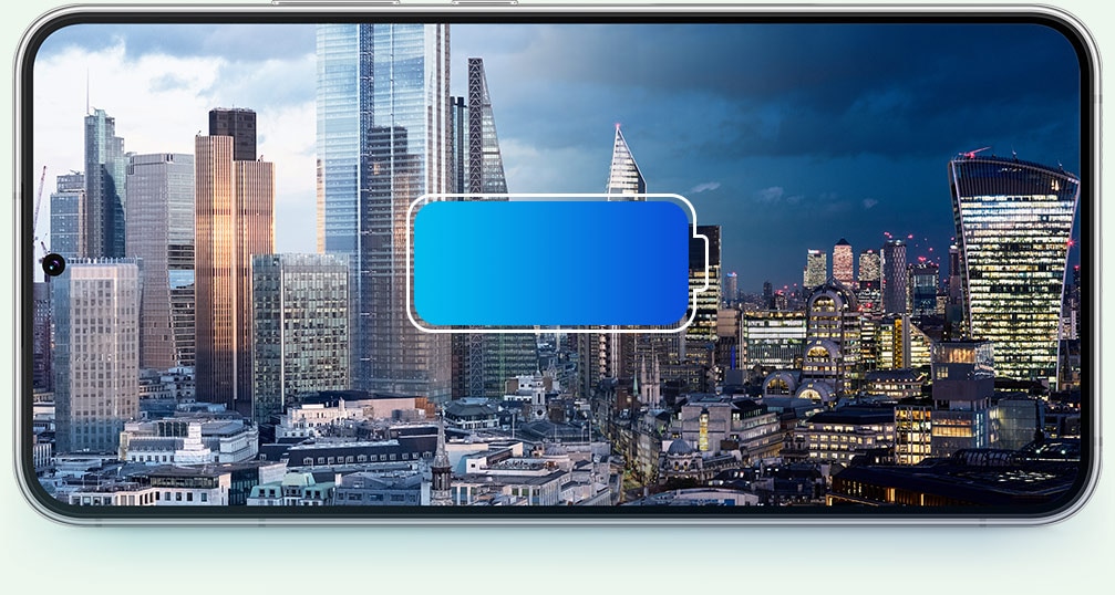 Galaxy S22 plus with a cityscape seen on the screen. A battery icon is in the front and the cityscape shifts from day to night to demonstrate the all-day battery life.