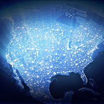 An illustrative image of a glowing light over a North America map.