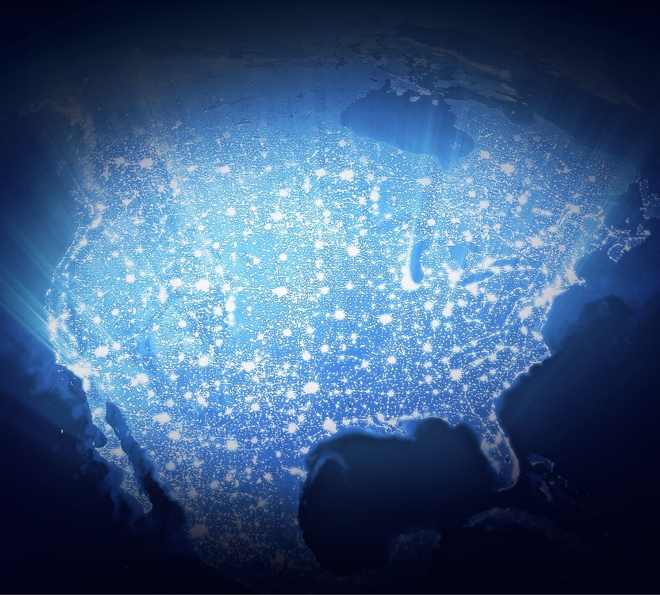 An illustrative image of a glowing light over a North America map.