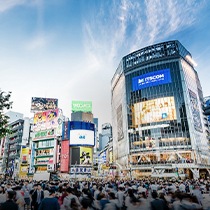 A photo image of a Japanese street full of people.