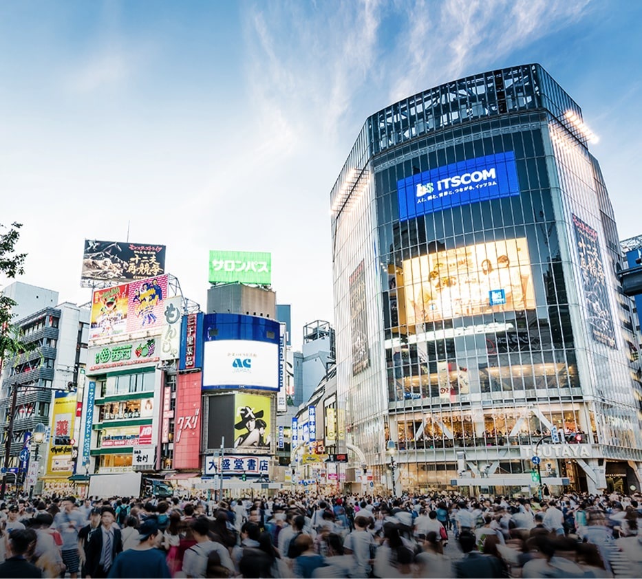 A photo image of a Japanese street full of people.