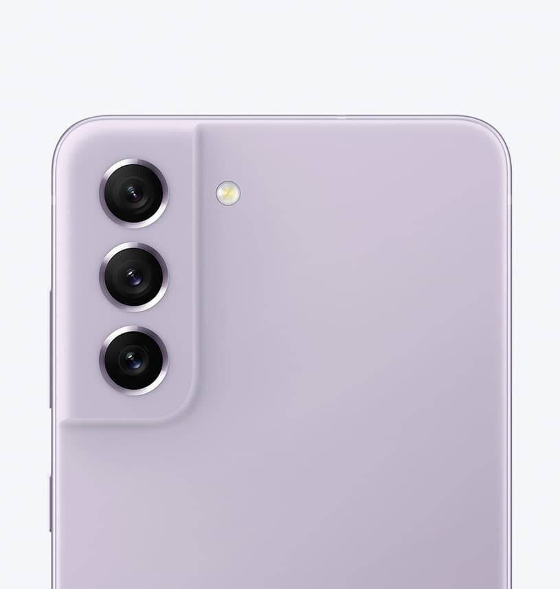 Galaxy S21 FE 5G in Lavender seen up-close from the rear, focused on its rear camera.