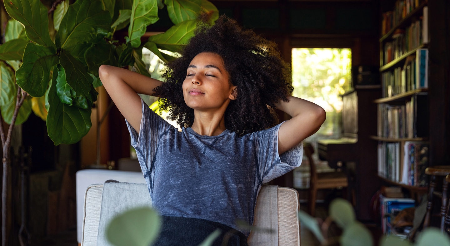 Young woman spending a relaxing day in her beautiful home