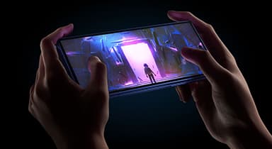 A game is being played on the bright, vivid screen of a Galaxy Z Fold7, which is folded and held horizontally like a game console.