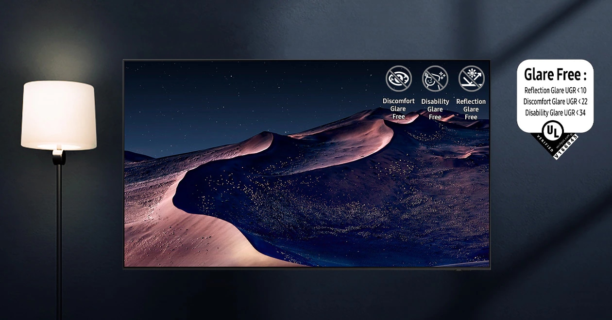 A TV displays a scene of a desert in a starry night. A nearby lamp throws distracting reflections on the screen. With glare-free technology, the screen becomes clear. No discomfort, disability, reflection icons. UL Verified Logo. Glare Free: Reflection Glare UGR < 10, Discomfort Glare < UGR 22, Disability Glare < 34. verifyUL.com®. V166045.