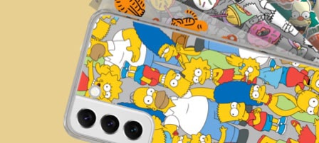 Back side of a Galaxy S22 with a Simpsons frame cover and differently designed backplates behind it.