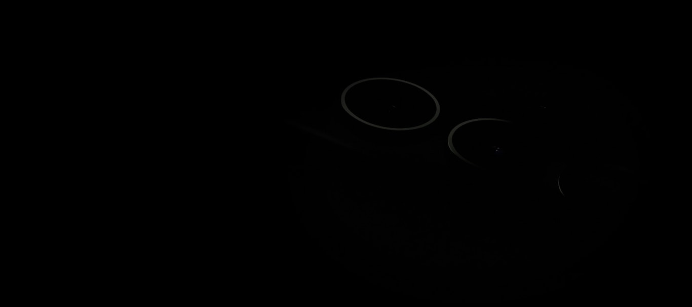 Two Galaxy S23 Ultra devices face one another upside down, screen to screen. As they move away from each other, the S Pen emerges from one device and comes to rest on top of the remaining Galaxy S23 Ultra, now seen from the rear.