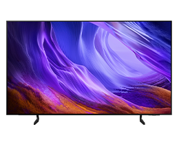 Un televisor Samsung OLED S85H muestra un paisaje abstracto en tonos azul y rojo en la pantalla.