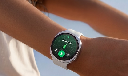 A person is wearing Samsung Galaxy Watch9 in Cream with a Sport Band in Cream while stretching their arms and a running training program is open on the watch display.