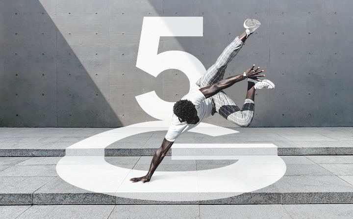 A man doing a backflip near concrete walls, in front of graphic text that says 5G, with the G appearing to lay flat