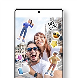 Centered is a Galaxy S25 Ultra displaying a gallery app screen showing a selfie of a cheerful male and female couple at a travel destination. The photo is decorated with cute stickers including a young male character, a confident female character wearing running clothes, a 3D white thumbs-up hand icon with a blue sleeve, pink and yellow 3D star icons, a yellow face emoji with sunglasses, and a "No cap" text sticker.