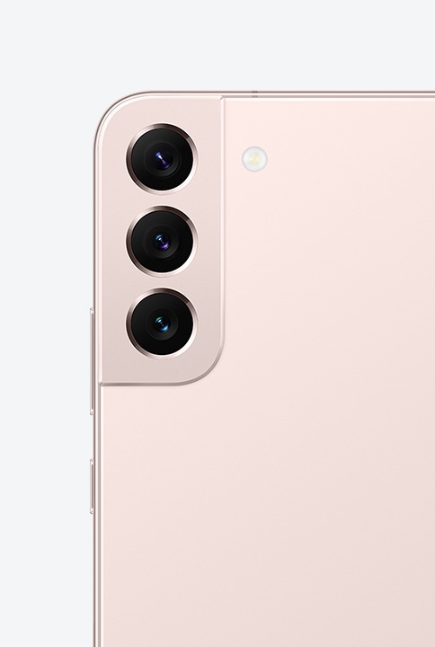 Two Galaxy S22 plus phones in Pink Gold. One shows a close-up of the Rear Camera. The other phone is seen from the side to show the symmetrical design.