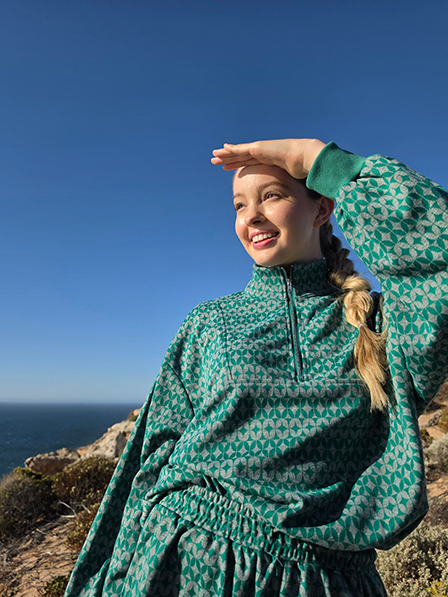 A scenic selfie of someone. AI ensures the lighting is accurately captured.
