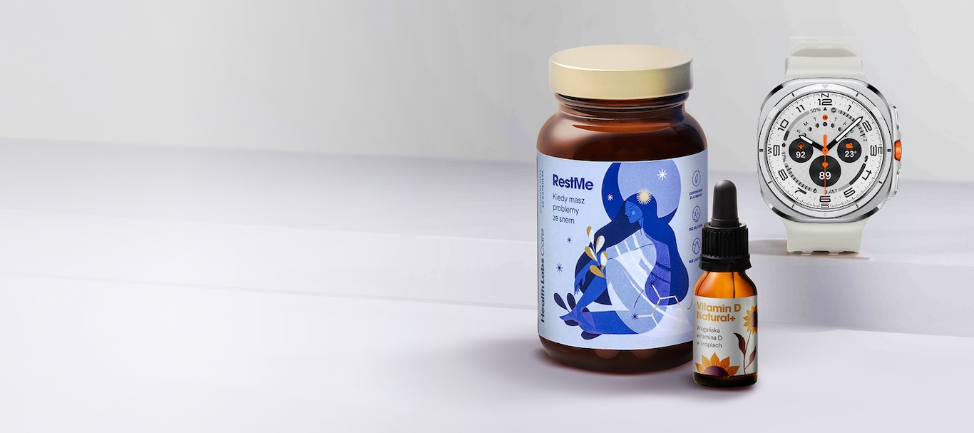 Biały Galaxy Watch Ultra obok suplementów Health Labs Care