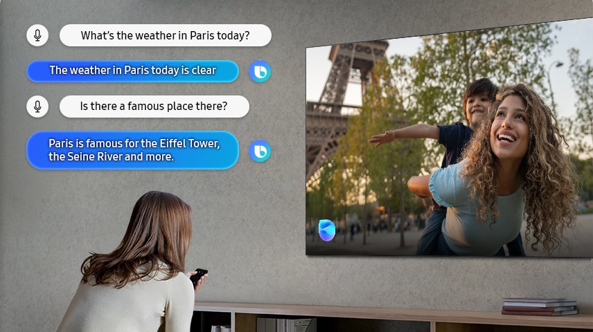 Uma senhora na sala de estar fala com a Bixby através da TV. São apresentadas legendas do diálogo. Como está o tempo hoje em Paris? O tempo hoje em Paris está bom. Há lá algum sítio famoso? Paris é famoso pela Torre Eiffel, o rio Sena e muito mais.