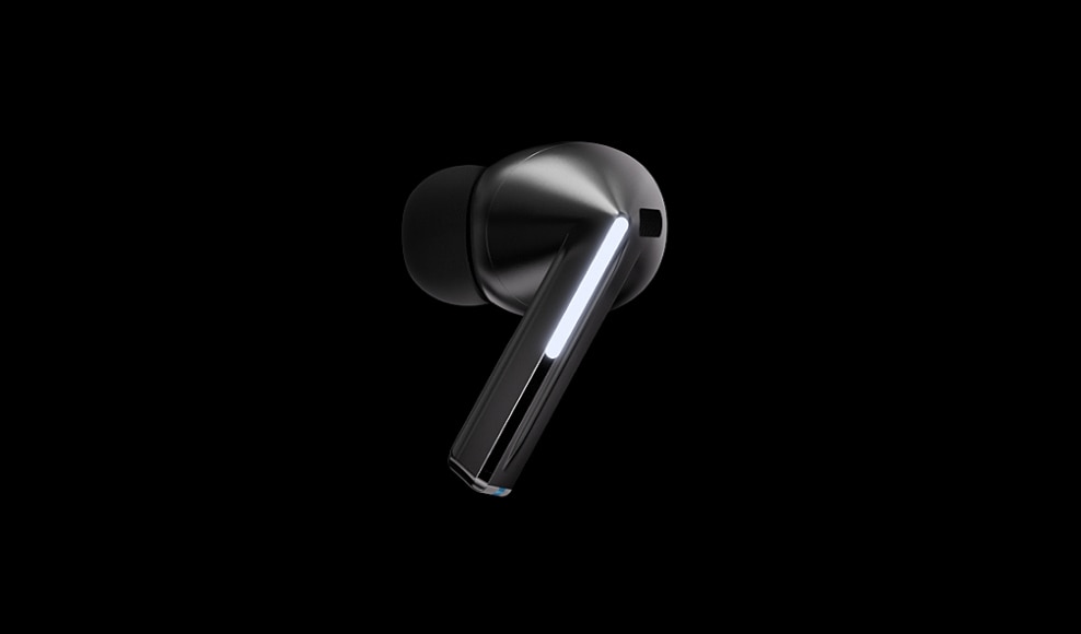 A sleek black Samsung Galaxy Buds3 wireless earbud is showcased against a dark background. This model, identified as R630nzaaasa, features a shiny finish, an elongated stem, and a small light indicator, highlighting its modern design and.