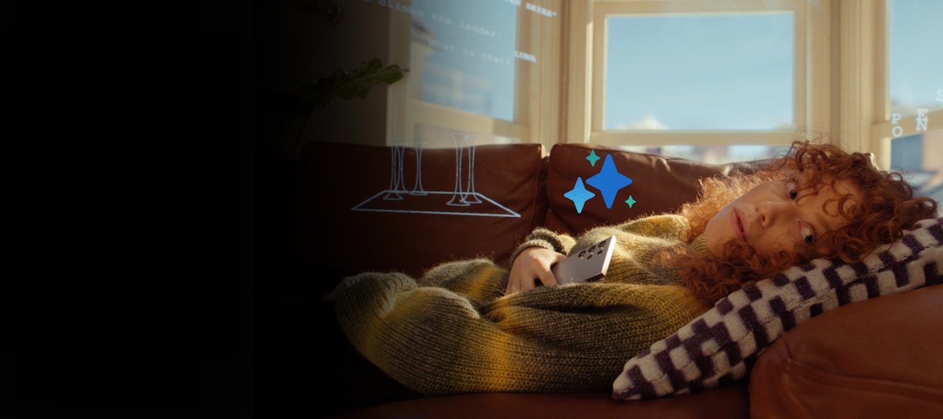 A person with curly hair is lying on a couch, holding a Galaxy S24 and looking to the side with an aspirational expression. The four-starred Galaxy AI logo floats above the Galaxy S24 smartphone.