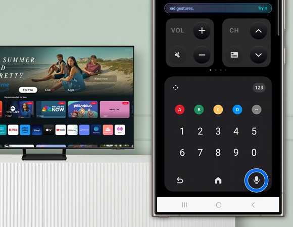 SmartThings app interface on a smartphone showing the microphone icon in the bottom right corner being tapped to access the TV’s microphone for voice commands with Bixby