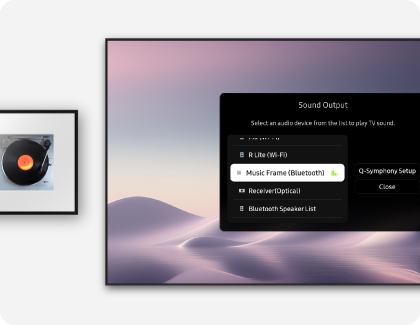 A Samsung TV showing the Sound Output menu, positioned alongside a Samsung Music Frame on a white wall