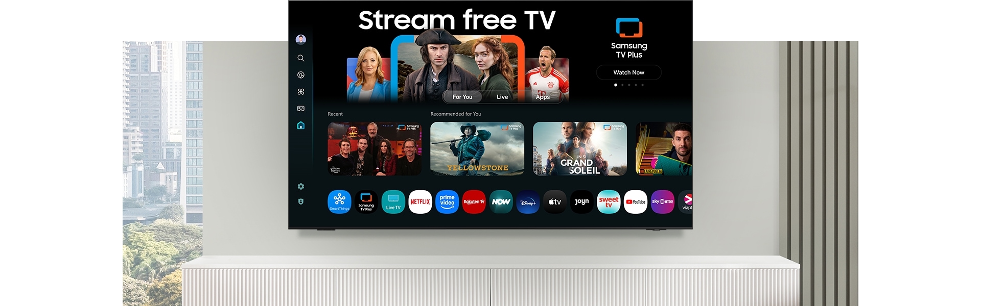 Televízor zobrazuje rozhranie One UI Tizen s možnosťami sledovania bezplatnej TV a rôznych aplikácií a služieb.