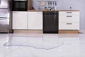Inspecting and tightening dishwasher drain line and water hose connections