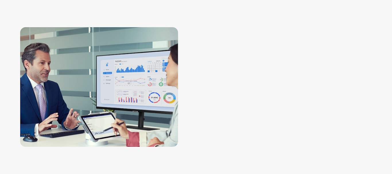 An image of a consultant providing financial consultation to a client with a tab.